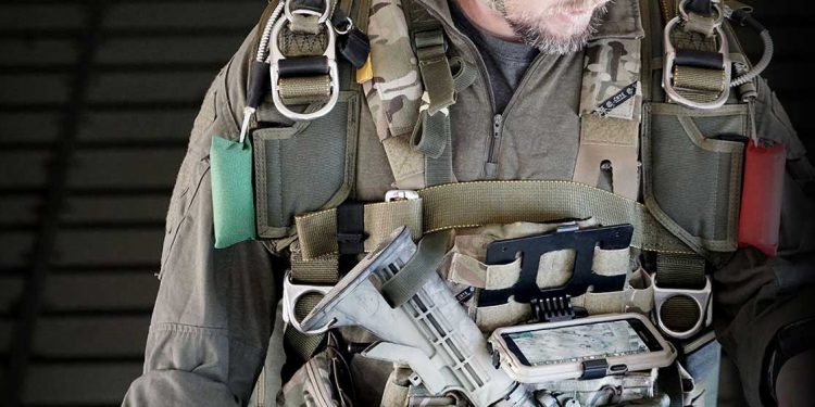defense operator with chest mounted ATAK app on phone
