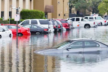 Submerged car in flooded street
