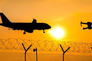 Plane and UAV over bared wire fence